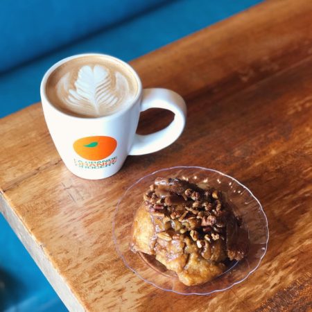 cup of coffee and monkey bread on a plate